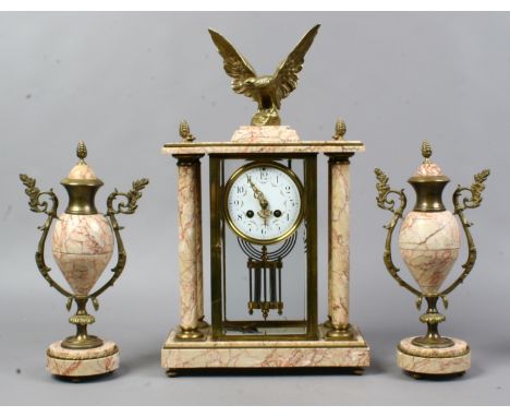 An early 20th century French brass and marble clock garniture with enamel dial, striking on a gong and with Mercury pendulum.
