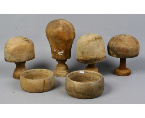 A group of millinery / hat makers wood block heads and hoops.