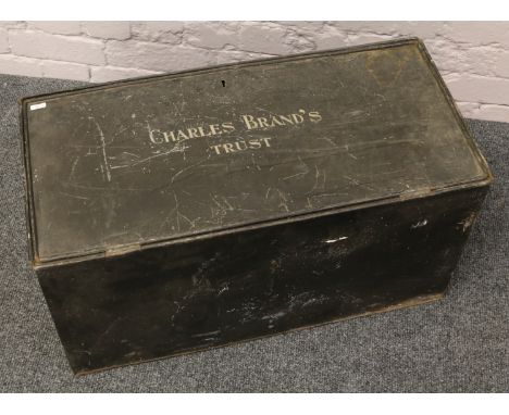 A tin travel trunk inscription Charles Brands Trust with Sally Line GB sticker.