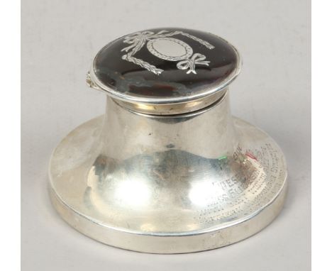 A silver Capstan inkwell with inlaid tortoise shell top, assayed London 1916.