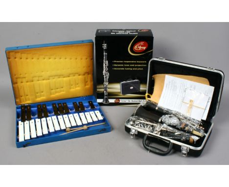 A boxed and cased Odyssey 'Debut' BB clarinet outfit, along with a cased xylophone.
