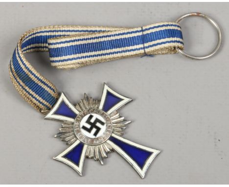 A German Third Reich silver and enamel medal Cross of Honour of the German Mother 16 December 1938.