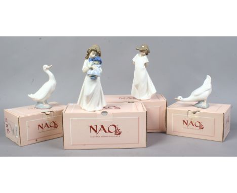 Four boxed Nao porcelain figures including a young girl holding a doll, geese etc.