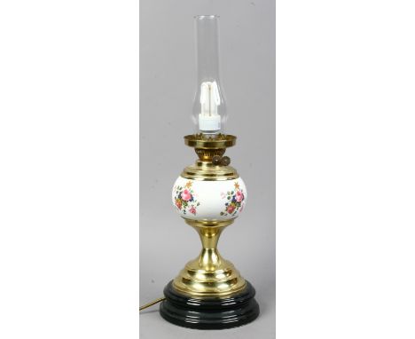 A table lamp formed as an oil lamp with pottery font and floral decoration.