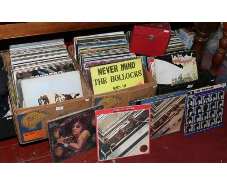 Three boxes of L.P records along with a carry case of 7 inch singles, including Led Zeppelin, The Beatles, Queen, Wings, Caro