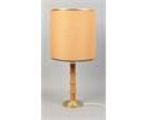 A 1970's table lamp with turned pine pedestal and Hessian shade.