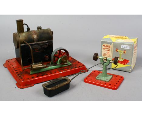 A Mamod steam engine along with a boxed Mamod miniature grinding machine.