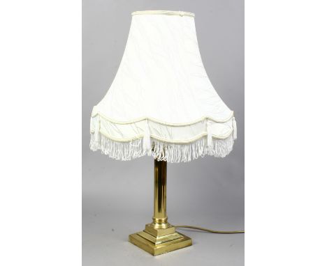 A brass column table lamp.