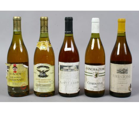 Five bottles of vintage Chardonnay, three Australian, one Chilean and one American.