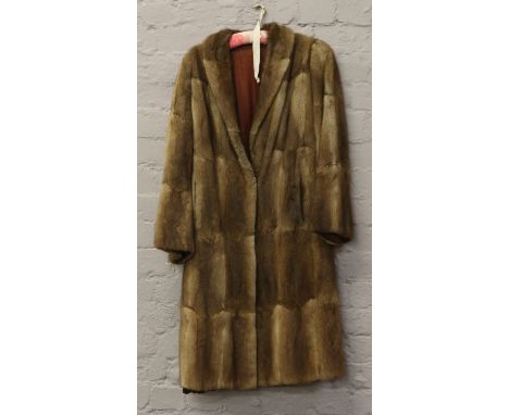 A ladies vintage full length fur coat.