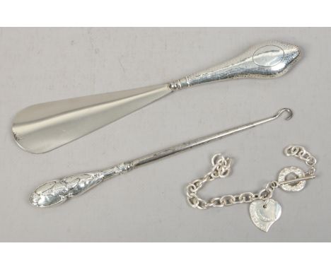 A silver handled shoe horn and button hook, assayed Birmingham 1903 along with a Tiffany style bracelet marked 925.