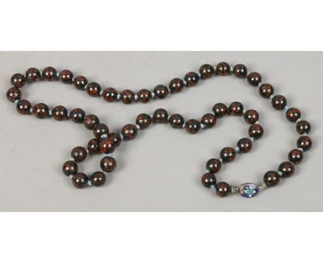 A string of Chinese export beads, lacquered and with enamel clasp.