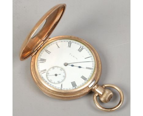 An Elgin gold plated demi hunter pocket watch with white enamel dial, subsidiary seconds and Roman numeral markers.