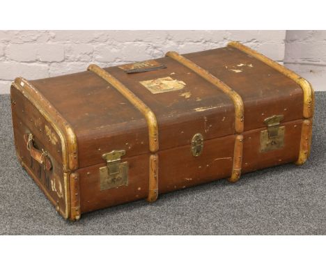 A wood bound canvas travel trunk, monogrammed E. J. M.