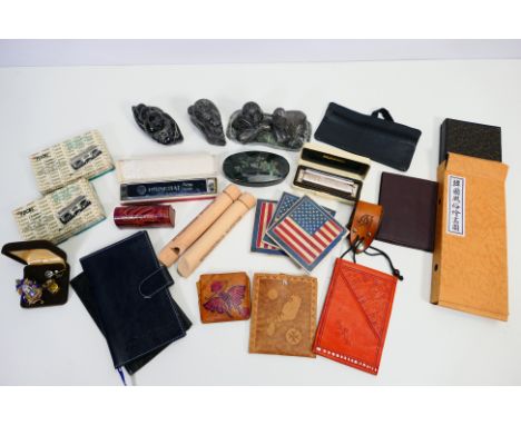 A mixed lot of collectibles to include traditional Canadian carvings, harmonicas, slide whistles, folding opera glasses, vint