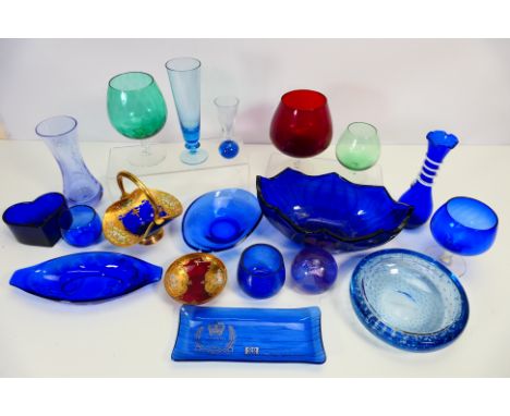 A quantity of coloured glassware comprising vases, bowls and similar, Caithness and other. [W]

NOTE: IN HOUSE SHIPPING IS NO