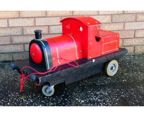 A scratch built wooden steam locomotive pull - a long. The locomotive measures approximately 80cm (L) x 35cm (W) x 45cm (H), 