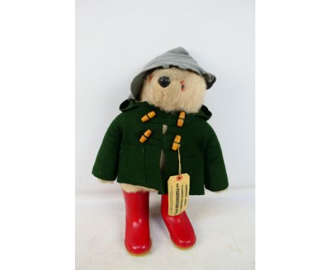 Dunolp - A vintage Paddington Bear soft toy with light blue hat and dark green coat, with tag. item appear to be in very good