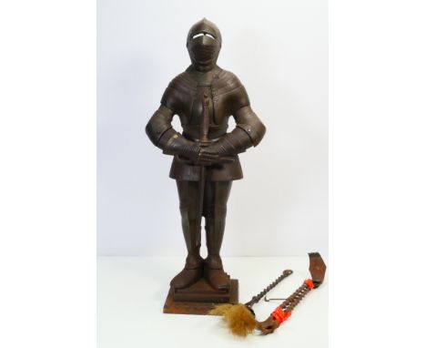 A vintage cast iron fireside companion set in the form of a knight in armour, approximately 67 cm (h). [W]