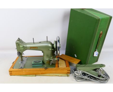 A vintage Jones Threadlite sewing machine in carry case. [W]