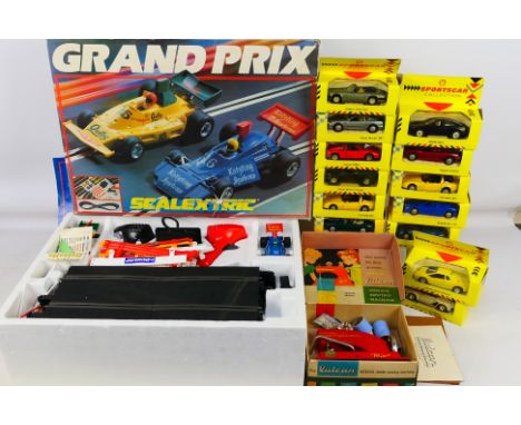 A good mixed lot comprising a Scalextric Grand Prix boxed set to include two racing cars, track, scenics, and ephemera; 13 of