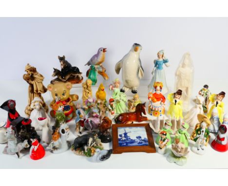 A collection of ceramics and other to include money banks, Sylvac, Wade, Chinese style and other. [W]

NOTE: IN HOUSE SHIPPIN