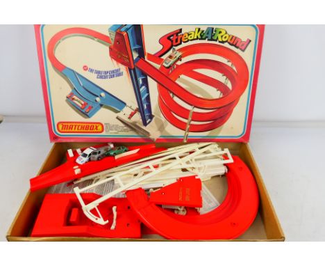 Matchbox - A boxed Matchbox S-900 'Streak-A-Round' circuit. The set shows signs of play wear and by and large appears to be i