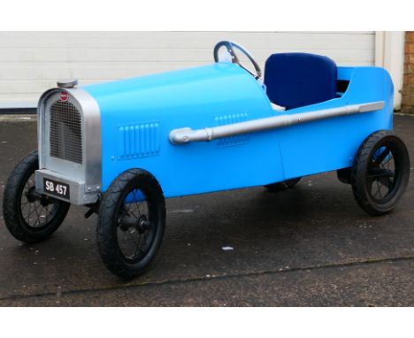 A scratch built battery powered Bugatti style car. The car measures approximately 148cm (L) x 50cm (W) x 65cm (H) and appears