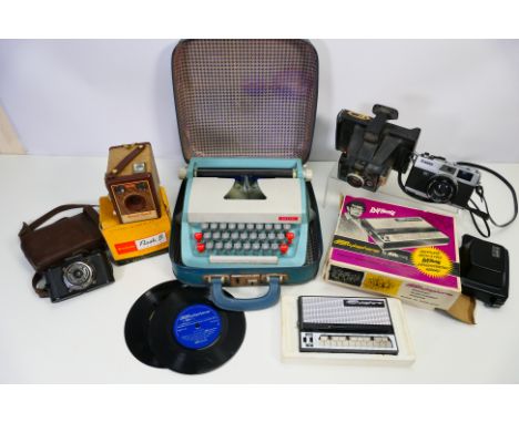Lot comprising cameras to include a Canon Canonet QL19 and other, a Petite portable typewriter, boxed Stylophone and other. [