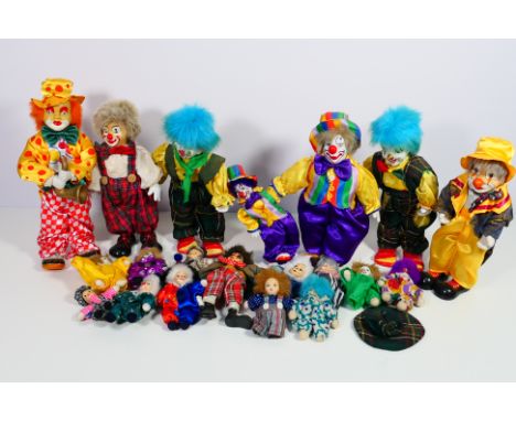 A shudder of approximately 18 unmarked 'Clown' figures / dolls in a variety of sizes. All show signs of display and condition