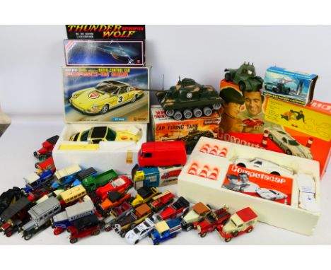 Mettoy - Nikko - Marx - Lledo - An assortment of vintage toys to include a Computacar, RC Porsche 911S, a battery operate Cap