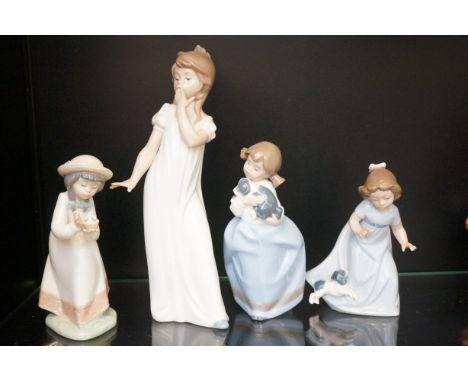 Four Nao child figurines 