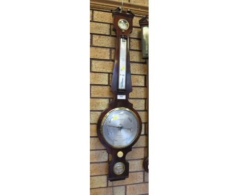 A 19th Century mahogany framed Barometer and Thermometer with silvered dials engraved F Amadio and Son, London, swan neck sur