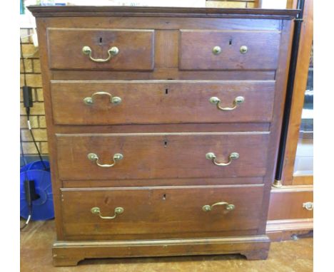 An 18th Century oak Chest of two short and three long drawers on bracket feet