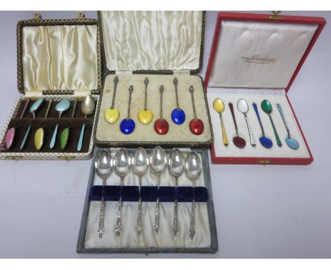 Three sets of silver and enamel Coffee Spoons and six plated apostle handled Coffee Spoons, all cased