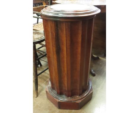 A 19th Century cylinder Bedside Cupboard, the rising marble top revealing a fitted blue and white basin above fluted sides on