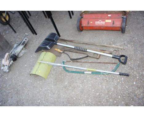 A quantity of long handled gardening tools, a saw etc.