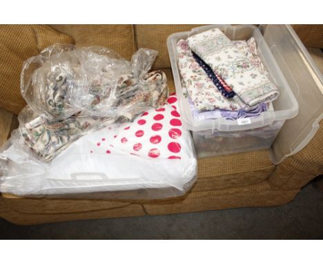 A box and a bag of various curtains and material