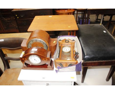 An Art Deco two hole mantel clock; an Edwardian mantel clock; a wall clock