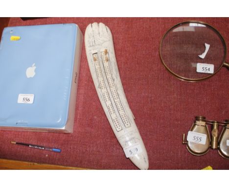 A reproduction scrimshaw cribbage board