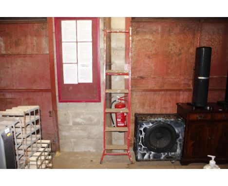 A wooden metal step ladder
