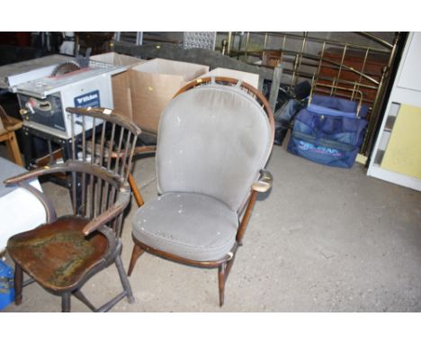 A dark Ercol armchair