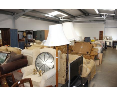 A teak standard lamp together with a mahogany turned standard lamp and shade 