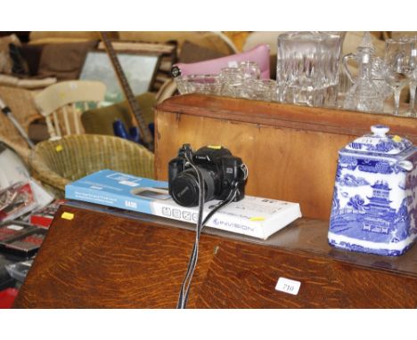 A Cannon EOS 5000 camera with a TV wall bracket 