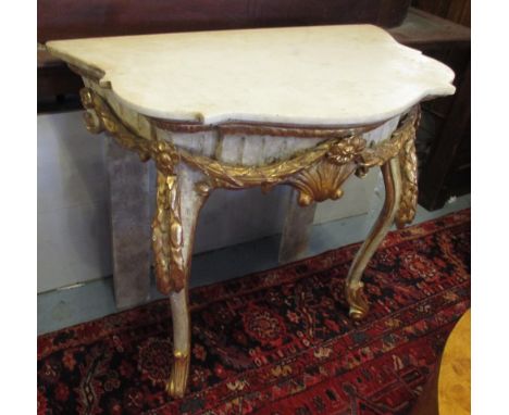 CONSOLE TABLE, 19th century Venetian parcel gilt shaped veined white marble fluted frieze, ribbon swag and cabriole front sup