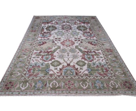 AMERICAN FLAT WEAVE CARPET. 360cm x 260cm, stylised palmettes and vine design on an ivory field within a repeat palmette jade