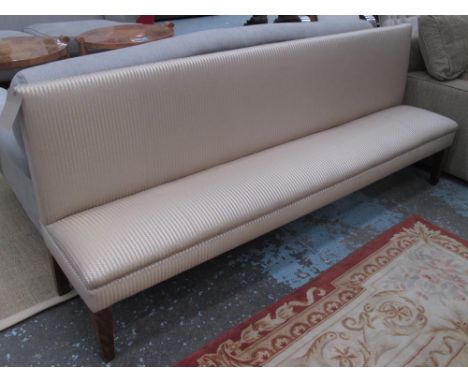 BANQUETTE/HALL SOFA, in gold striped fabric on square supports, 216cm L.