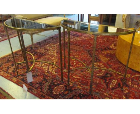 CONSOLE TABLES, a pair, Venetian style demi-lune, gilded metal with mirrored tops, 90cm x 33cm D x 74cm H. (2)