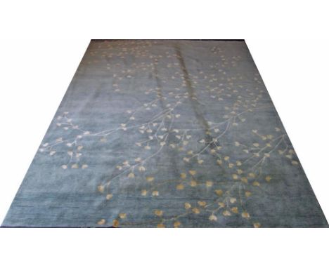 JAIPUR CARPET, 360cm x 270cm, of blossom design in gilt on turquoise field.