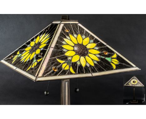 A Table Lamp with Tiffany Style Glass Shade, sunflower decoration, on a bronzed tapering square base.  Height 22".
